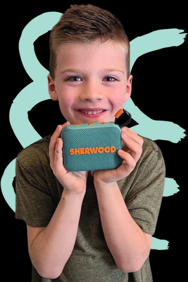 A child holding the free Sherwood Bluetooth speaker